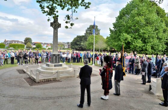 New Milton residents assemble around the War Memorial to remember VE80